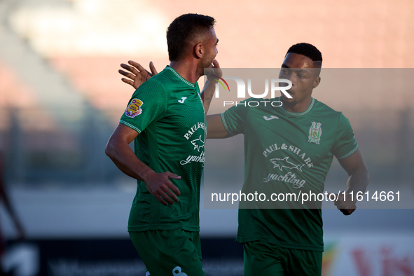 Jake Grech (L) of Floriana celebrates scoring the 1-0 goal with teammate Kemar Reid (R) during the Malta 360 Sports Premier League soccer ma...