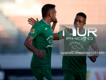 Jake Grech (L) of Floriana celebrates scoring the 1-0 goal with teammate Kemar Reid (R) during the Malta 360 Sports Premier League soccer ma...