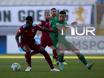 Luis Carlo Riascos (left) of Gzira United is followed by Nicolas Marias Garcia (right) of Floriana during the Malta 360 Sports Premier Leagu...