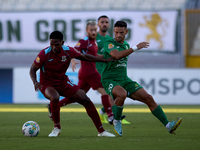 Luis Carlo Riascos (left) of Gzira United is followed by Nicolas Marias Garcia (right) of Floriana during the Malta 360 Sports Premier Leagu...