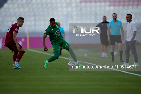 Kemar Reid (R) of Floriana is closely followed by Thiago Espindola de Paula (L) of Gzira United during the Malta 360 Sports Premier League s...