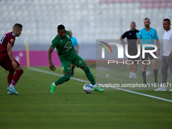 Kemar Reid (R) of Floriana is closely followed by Thiago Espindola de Paula (L) of Gzira United during the Malta 360 Sports Premier League s...