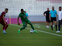 Kemar Reid (R) of Floriana is closely followed by Thiago Espindola de Paula (L) of Gzira United during the Malta 360 Sports Premier League s...