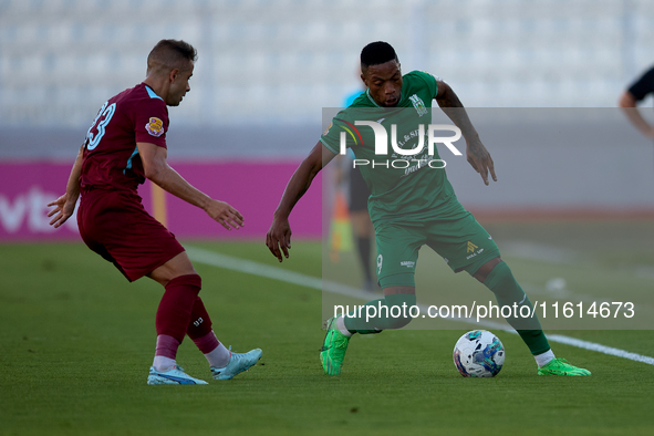 Kemar Reid (R) of Floriana is closely followed by Thiago Espindola de Paula (L) of Gzira United during the Malta 360 Sports Premier League s...