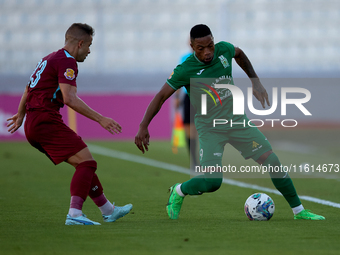 Kemar Reid (R) of Floriana is closely followed by Thiago Espindola de Paula (L) of Gzira United during the Malta 360 Sports Premier League s...