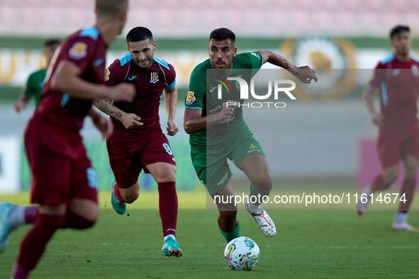 Jake Grech (R) of Floriana is in action during the Malta 360 Sports Premier League soccer match between Floriana and Gzira United at the Nat...