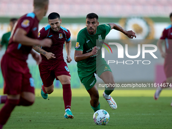 Jake Grech (R) of Floriana is in action during the Malta 360 Sports Premier League soccer match between Floriana and Gzira United at the Nat...