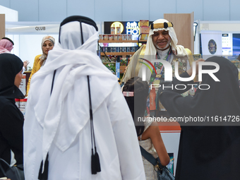 A Saudi Arabian exhibitor shows coffee products at a booth during the 2024 Doha International Coffee Exhibition at Doha Exhibition and Conve...