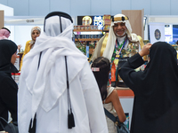 A Saudi Arabian exhibitor shows coffee products at a booth during the 2024 Doha International Coffee Exhibition at Doha Exhibition and Conve...