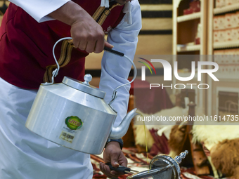 A man prepares Arabic coffee at the 2024 Doha International Coffee Exhibition at Doha Exhibition and Convention Center in Doha, Qatar, on Se...