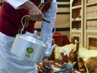 A man prepares Arabic coffee at the 2024 Doha International Coffee Exhibition at Doha Exhibition and Convention Center in Doha, Qatar, on Se...