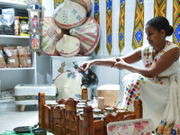 An exhibitor prepares Ethiopian coffee at an exhibition during the 2024 Doha International Coffee Exhibition at Doha Exhibition and Conventi...