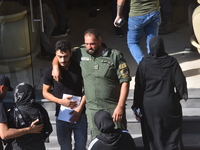 Lebanese clerics pray over the coffins of 16 people, including three Hezbollah militants, who are killed in an Israeli airstrike on the vill...