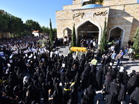 Lebanese clerics pray over the coffins of 16 people, including three Hezbollah militants, who are killed in an Israeli airstrike on the vill...