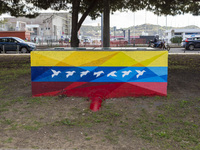 Cars drive by a Venezuelan flag painted by the street artist Flix Robotico in Lisbon, Portugal, on September 27, 2024. Data from the BdP ind...