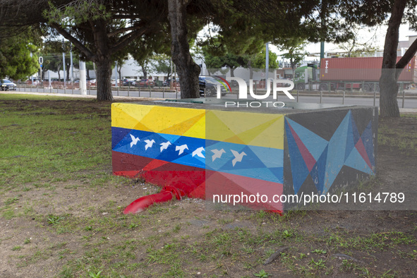 Cars drive by a Venezuelan flag painted by the street artist Flix Robotico in Lisbon, Portugal, on September 27, 2024. Data from the BdP ind...