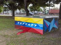 Cars drive by a Venezuelan flag painted by the street artist Flix Robotico in Lisbon, Portugal, on September 27, 2024. Data from the BdP ind...