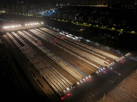 Bullet trains stop at the Nanjing South Railway station in Nanjing, China, on September 28, 2024. China's railways are expected to carry 175...