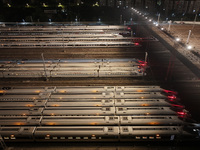 Bullet trains stop at the Nanjing South Railway station in Nanjing, China, on September 28, 2024. China's railways are expected to carry 175...