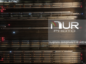 Bullet trains stop at the Nanjing South Railway station in Nanjing, China, on September 28, 2024. China's railways are expected to carry 175...