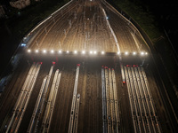 Bullet trains stop at the Nanjing South Railway station in Nanjing, China, on September 28, 2024. China's railways are expected to carry 175...