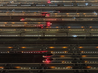 Bullet trains stop at the Nanjing South Railway station in Nanjing, China, on September 28, 2024. China's railways are expected to carry 175...