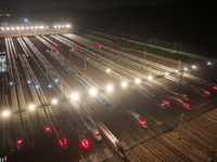 Bullet trains stop at the Nanjing South Railway station in Nanjing, China, on September 28, 2024. China's railways are expected to carry 175...