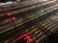 Bullet trains stop at the Nanjing South Railway station in Nanjing, China, on September 28, 2024. China's railways are expected to carry 175...