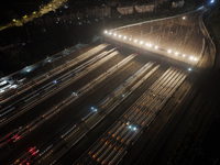 Bullet trains stop at the Nanjing South Railway station in Nanjing, China, on September 28, 2024. China's railways are expected to carry 175...