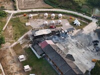 A hotel house is engulfed by fire in Xindian town, Tongren, China, on September 27, 2024. (