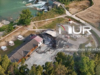 A hotel house is engulfed by fire in Xindian town, Tongren, China, on September 27, 2024. (