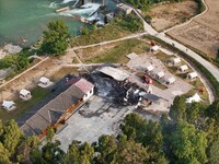 A hotel house is engulfed by fire in Xindian town, Tongren, China, on September 27, 2024. (