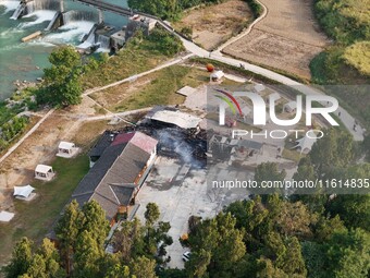 A hotel house is engulfed by fire in Xindian town, Tongren, China, on September 27, 2024. (