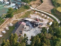 A hotel house is engulfed by fire in Xindian town, Tongren, China, on September 27, 2024. (