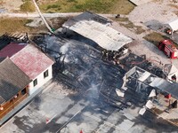 A hotel house is engulfed by fire in Xindian town, Tongren, China, on September 27, 2024. (