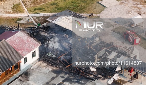 A hotel house is engulfed by fire in Xindian town, Tongren, China, on September 27, 2024. 