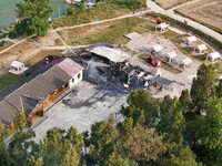 A hotel house is engulfed by fire in Xindian town, Tongren, China, on September 27, 2024. (