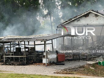 A hotel house is engulfed by fire in Xindian town, Tongren, China, on September 27, 2024. (