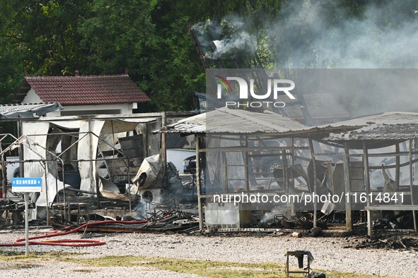 A hotel house is engulfed by fire in Xindian town, Tongren, China, on September 27, 2024. 