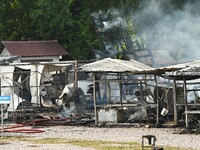 A hotel house is engulfed by fire in Xindian town, Tongren, China, on September 27, 2024. (