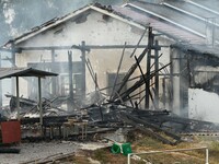 A hotel house is engulfed by fire in Xindian town, Tongren, China, on September 27, 2024. (