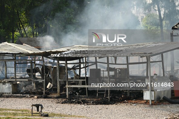 A hotel house is engulfed by fire in Xindian town, Tongren, China, on September 27, 2024. 