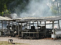 A hotel house is engulfed by fire in Xindian town, Tongren, China, on September 27, 2024. (