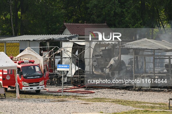 A hotel house is engulfed by fire in Xindian town, Tongren, China, on September 27, 2024. 