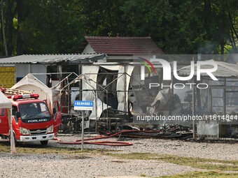 A hotel house is engulfed by fire in Xindian town, Tongren, China, on September 27, 2024. (