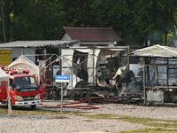 A hotel house is engulfed by fire in Xindian town, Tongren, China, on September 27, 2024. (