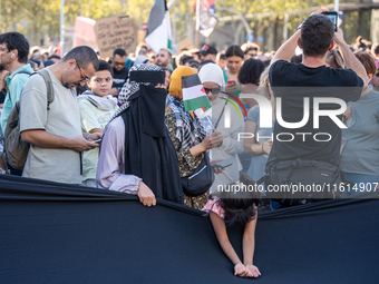 Thousands of people demonstrate in the center of Barcelona, Spain, on September 27, 2024, on the day that a general strike is declared in Sp...