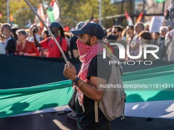 Thousands of people demonstrate in the center of Barcelona, Spain, on September 27, 2024, on the day that a general strike is declared in Sp...