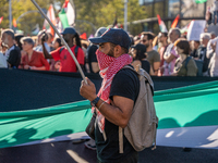 Thousands of people demonstrate in the center of Barcelona, Spain, on September 27, 2024, on the day that a general strike is declared in Sp...