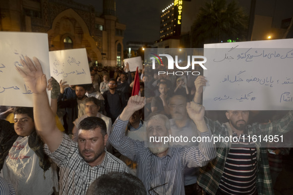 Iranian protesters shout anti-Israeli and anti-U.S. slogans while taking part in a protest gathering to condemn an Israeli air strike agains...